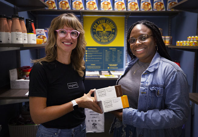 Soylent team member donating a few cases of products to a local food band
