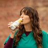 Woman drinking Soylent